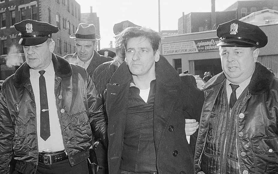 DESALVO - Albert DeSalvo, 35, is surrounded by police after his capture in Lynn, Ma. on Feb. 25, 1967. DeSalvo was nabbed in a store a day after he escaped from Bridgewater State Hospital for the criminally insane.  (AP Photo)